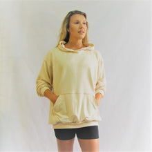 Load image into Gallery viewer, Almond coloured bamboo cotton hoodie. Soft and roomy. This really shows of the tan. Made in Canada.