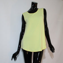 Load image into Gallery viewer, Butter colored tank top with rounded hemline on a black manikin.