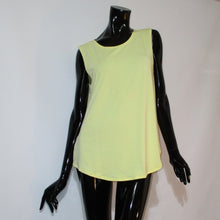 Load image into Gallery viewer, Butter colored tank top with rounded hemline on a black manikin.