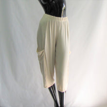 Load image into Gallery viewer, almond coloured capris with pockets on a manikin