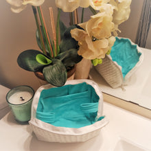 Load image into Gallery viewer, peakybeach white makeup bag sitting on the counter.  candle and flowers in the background.