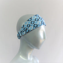 Load image into Gallery viewer, Head band with navy and white hollow squares on a light blue back ground.  Back neck has a one inch elastic covered in the same fabric. Beach lovers will love this.