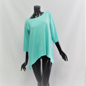 Caribbean blue casual top for women. Made from bamboo and cotton, very soft to touch.  Boat neck , 3/4 sleeve length and a curved hemline. Cut and Sewn in Canada. 
