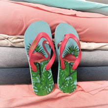 Load image into Gallery viewer, A pair of  beachcomber flip flops in front of peakybeach rolls of bamboo cotton fabric used in clothing. The colours match perfectly.